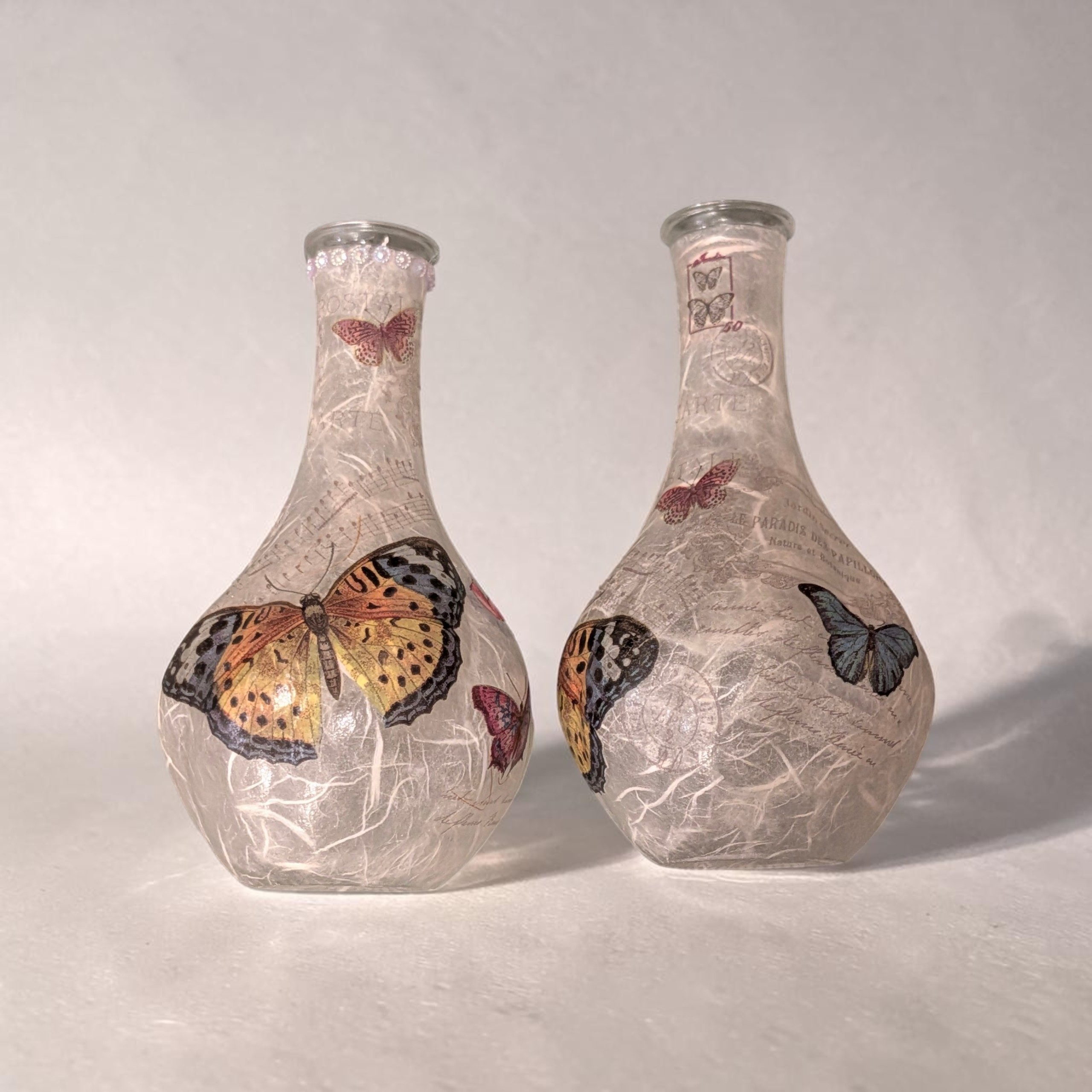 Pair of Handcrafted Decoupage Glass Bottles / Bud Vases - Butterfly & Vintage Stamp Motif